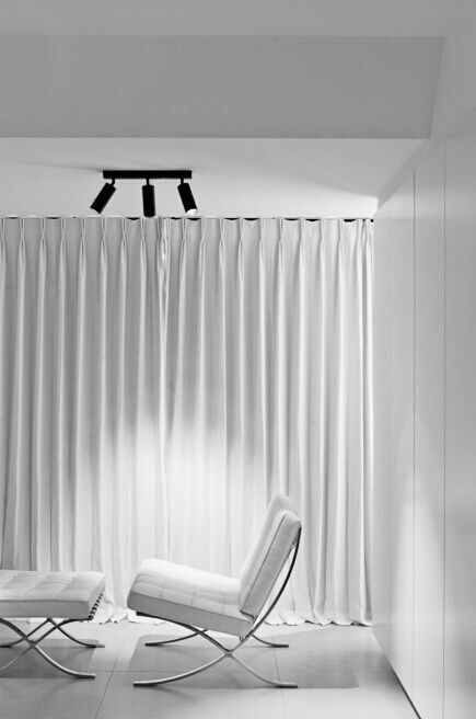 white barcelona chair and Ottoman